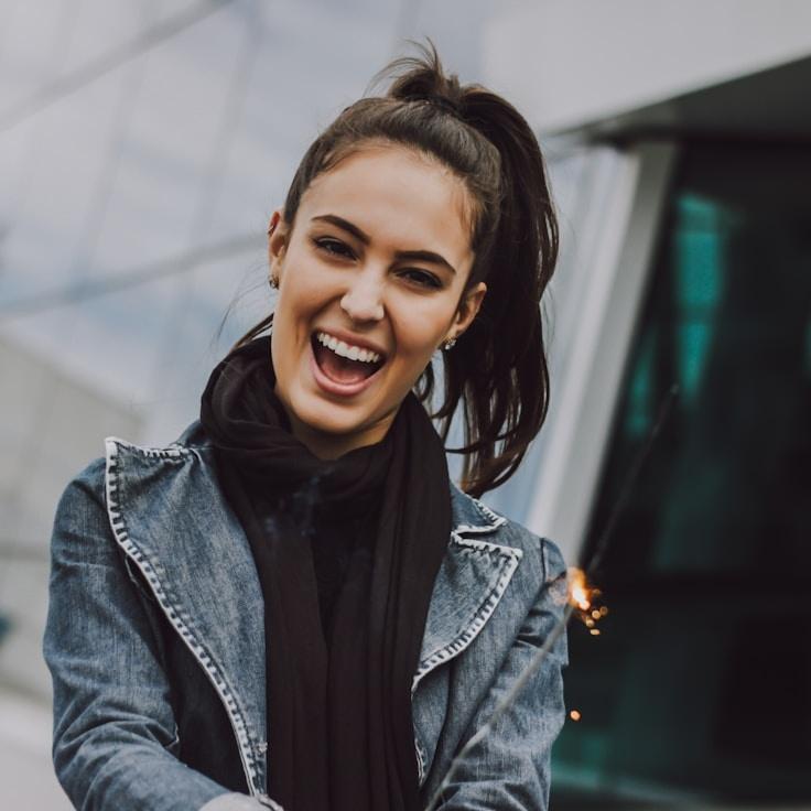 Aisha Rao, Lead Design Curator at Nook Canvas Garden, reviewing corporate floral arrangements
